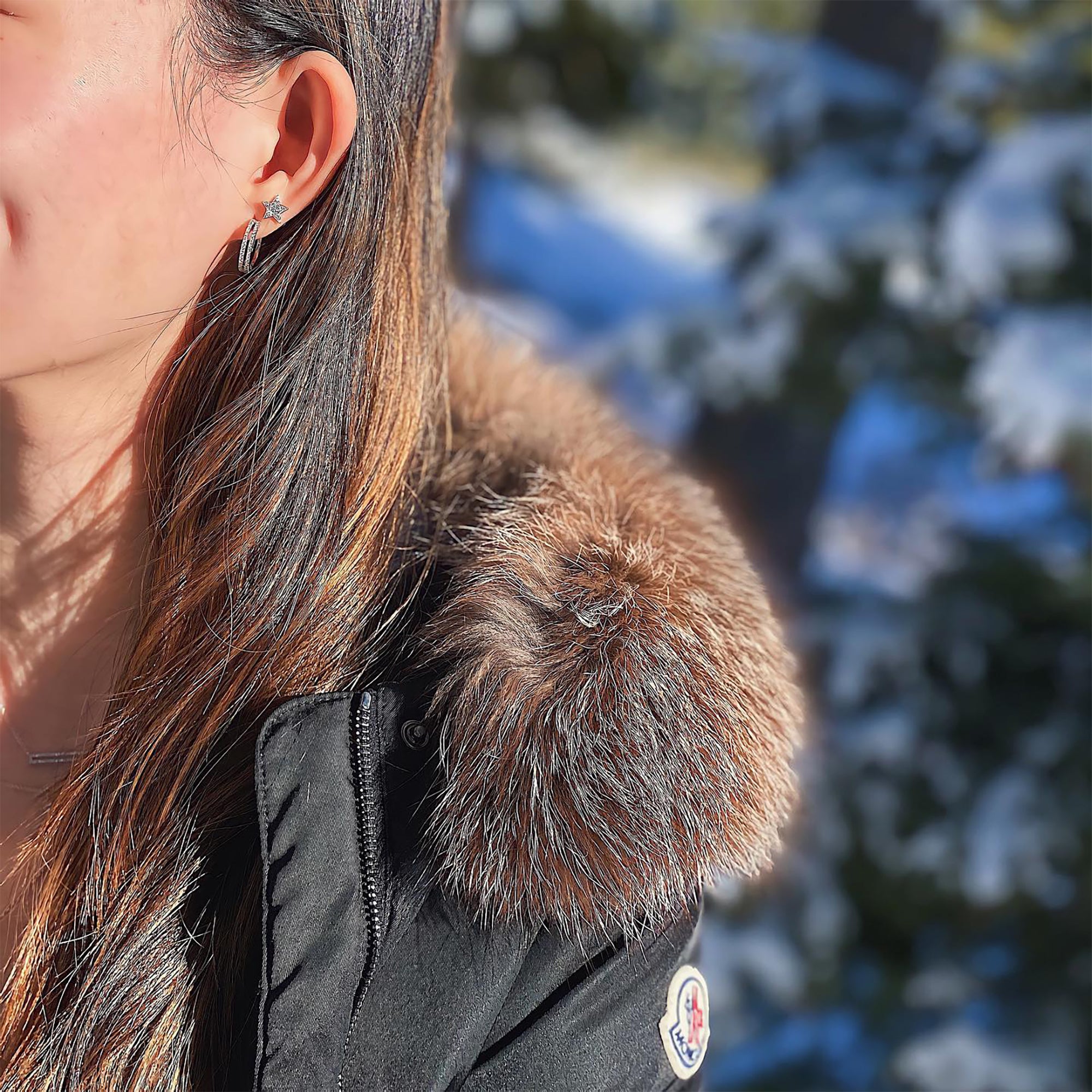 woman is wearing the Open Bar Diamond Huggies